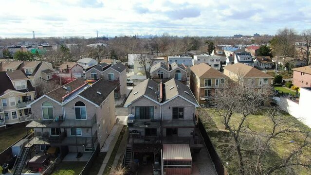 Aerial Pull Back Shot of Waterfront Homes in the Bronx