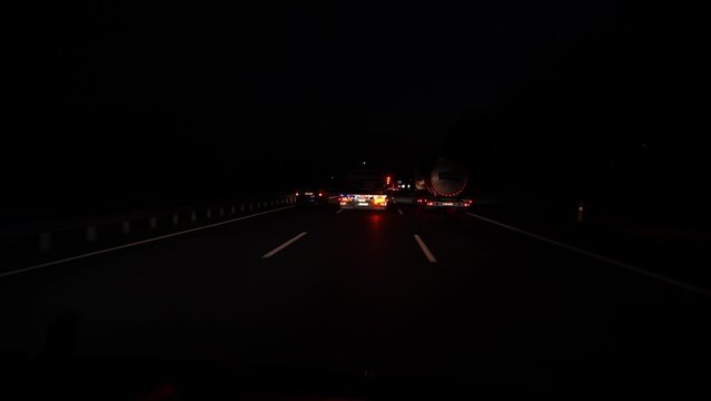 Fast driving on the german autobahn at night. Traffic on a German highway. no limits