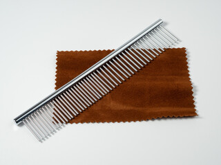 Comb for dog care. Dog grooming comb. Close-up of a comb.