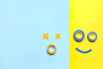 Faces made of adhesive tapes on color background