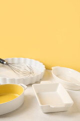 Set of different kitchen utensils for baking on color background