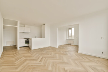 an empty living room with wood flooring and white walls in the room is very clean, but there is no furniture