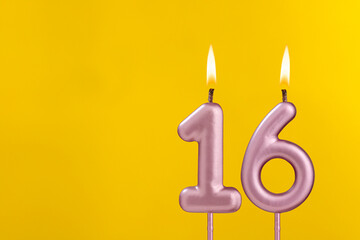 Birthday candle number 16 - Birthday celebration on yellow background