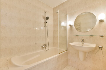 a bathroom with a sink, mirror and bathtub on the wall next to it is a toilet in the corner