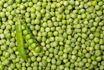 Fototapeta na wymiar Fresh green peas as background, top view