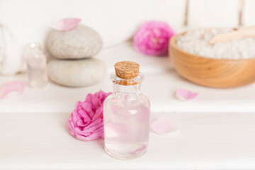 Spa composition with pink roses on wooden table