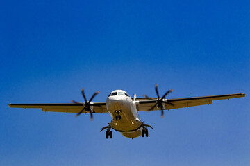 view of plane landing at our well-deserved vacation destination