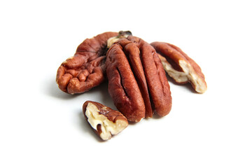 Peeled pecan nuts isolated on a white background. Heap of pecan halves