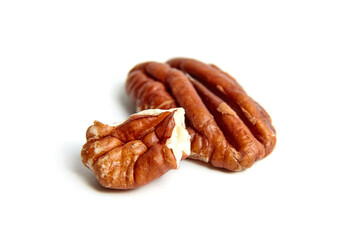 Pecan nut kernels isolated on a white background. Heap of peeled pecan halves