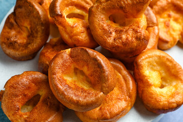 Tasty Yorkshire pudding on table, closeup