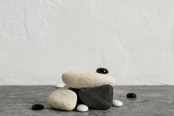 Decorative stone podiums on grey table
