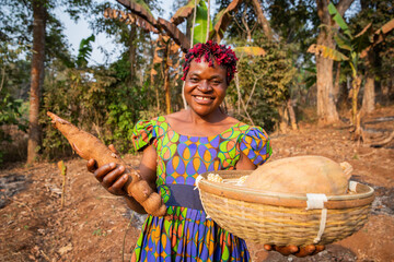 A smiling peasant woman with her harvest basket in the fields, small business owner in Africa