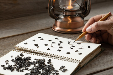 hand writing random letters on white paper, dementia and dyslexia concept