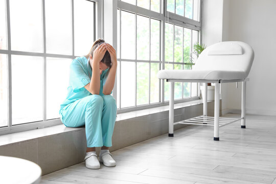 Stressed female medical intern at hospital