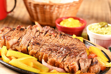 roasted meat with vegetables, barbecue with herb sauces, grilled steak