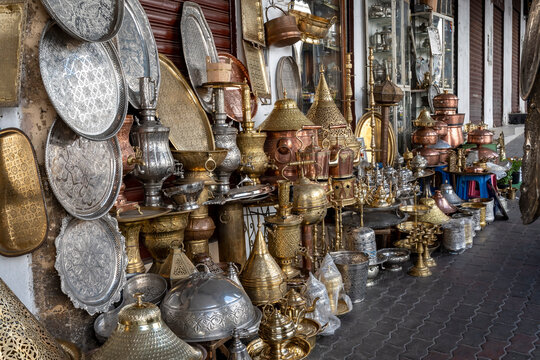 Lanterns, plates and vases in embossed metal, typical Moroccan craftsmanship under the arches of Rue Ibn Khaldoun, in the medina of the Habaus district of Casablanca.