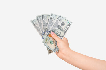 Female hand holding one hundred dollar banknotes on white background