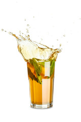 Glass of ice tea with splashes on white background