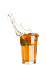 Glass of ice tea with splashes on white background
