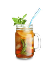 Mason jar of ice tea with lemon and mint on white background