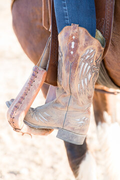 Cowboy boots in stirrup 