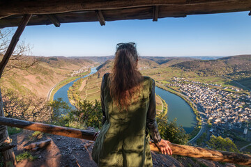 Woman at scenic view from Calmont hiking trail to Moselle loop (germ. Moselschleife), Germany - obrazy, fototapety, plakaty