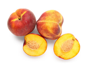 Fototapeta na wymiar Halves of sweet peach on white background