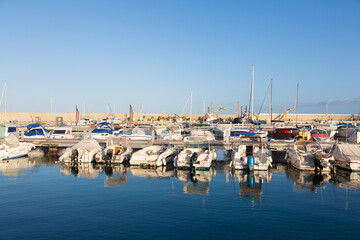Fototapeta na wymiar Small marina, fishing and industrial port in the town of Garrucha in the province of Almeria, Andalusia, Spain.