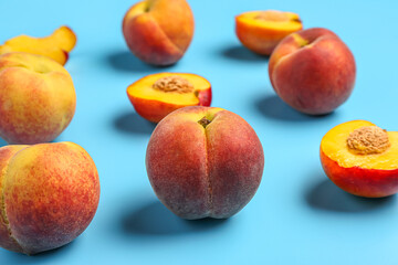Sweet peaches on blue background