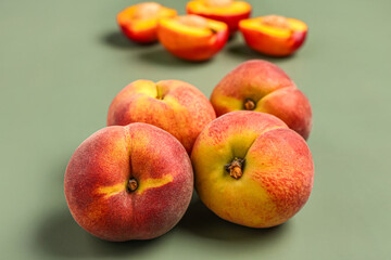 Many sweet peaches on grey background