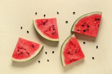 Pieces of fresh watermelon on beige background