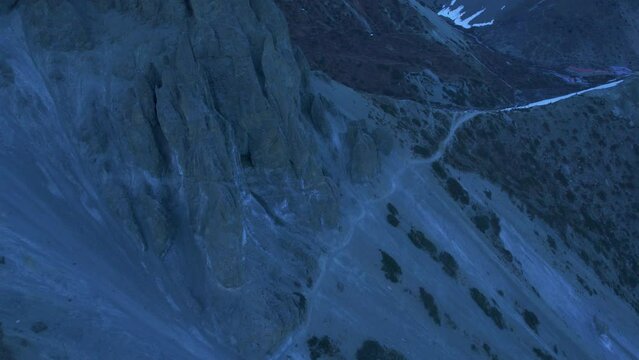 Birds eye view group of hikers hike on trail to Tilicho lake in high himalaya mountains. Trekking adventure, challenge, safety and tours n Himalaya mountains concept