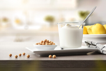 Soy yogurt and bowl with grains on plate in kitchen