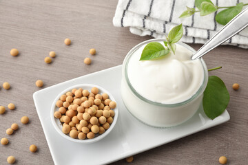 Soy yogurt and grains on plate on wooden bench