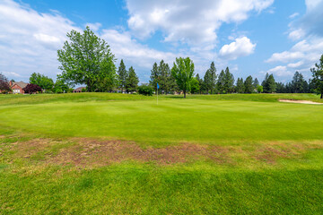 Manicured fairways, greens and hazards at a suburban golf course, part of a luxury golf community of homes in the rural town of Post Falls, Idaho, in the general Coeur d'Alene area of North Idaho.
