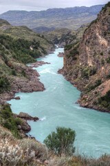 Photo of a serene river flowing through the breathtaking Patagonian landscape in Chile