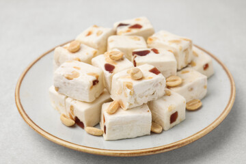 Pieces of delicious nutty nougat on light table