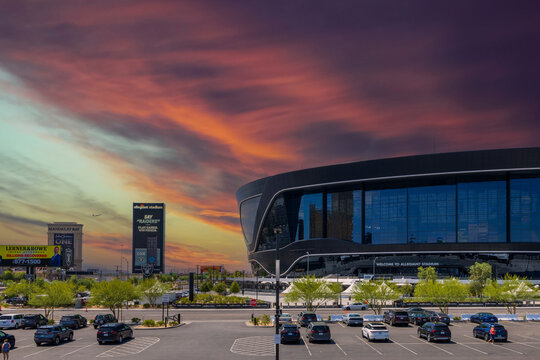 A gorgeous spring landscape at Allegiant Stadium surrounded by lush green trees and plants and powerful clouds at sunset in Las Vegas Nevada USA