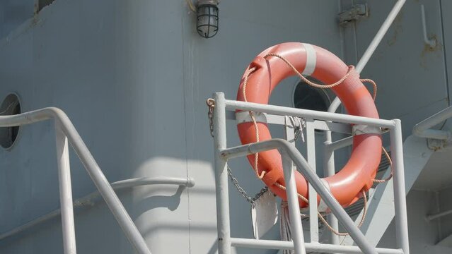 The orange bouy on the side of the ship on the port in Estonia