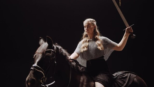 Woman Warrior Riding Horse In Studio
