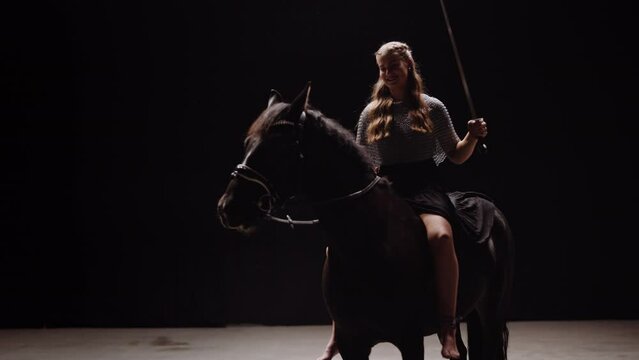 Lady Warrior Riding Horse In Studio