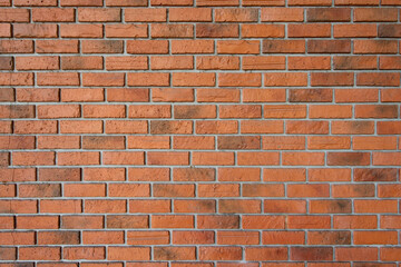 Orange polygonal brick wall background texture, retro style brick design