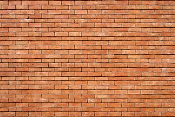 Orange polygonal brick wall background texture, retro style brick design