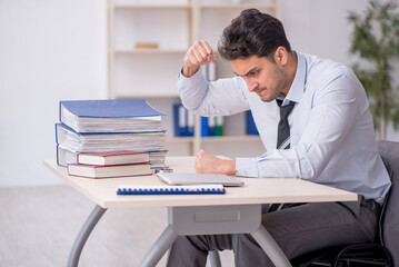 Young male employee working in the office