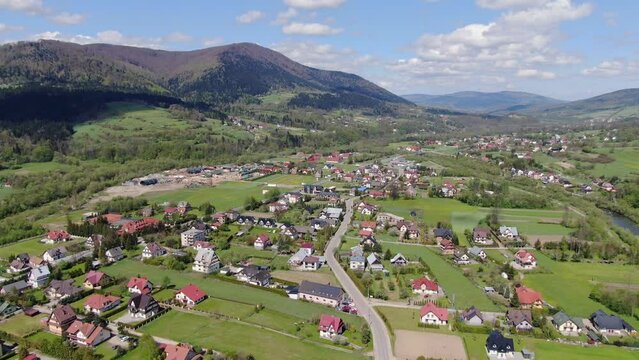 Aerial panorama of Mszana Dolna village, Poland on sunny summer day