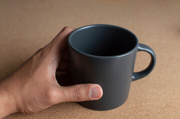  Man hand holding a cup of coffee 