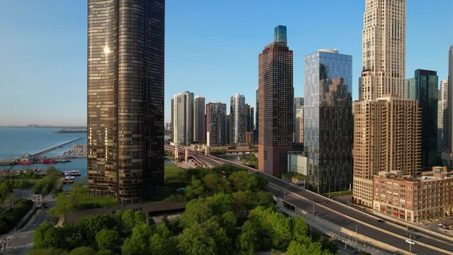 Cars Traveling Past City Highrses Next To Lake