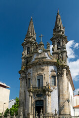 Fototapeta na wymiar Guimaraes, Portugal. April 14, 2022:Church and oratory of Our Lady of Consolation and Santos Passos. Architecture and facade with blue sky.