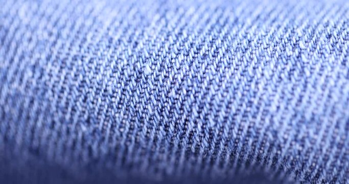 close-up of a new blue denim fabric, part of a pair of blue denim pants