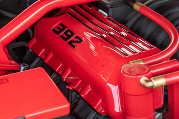 Close up of bright red engine in a classic muscle car
